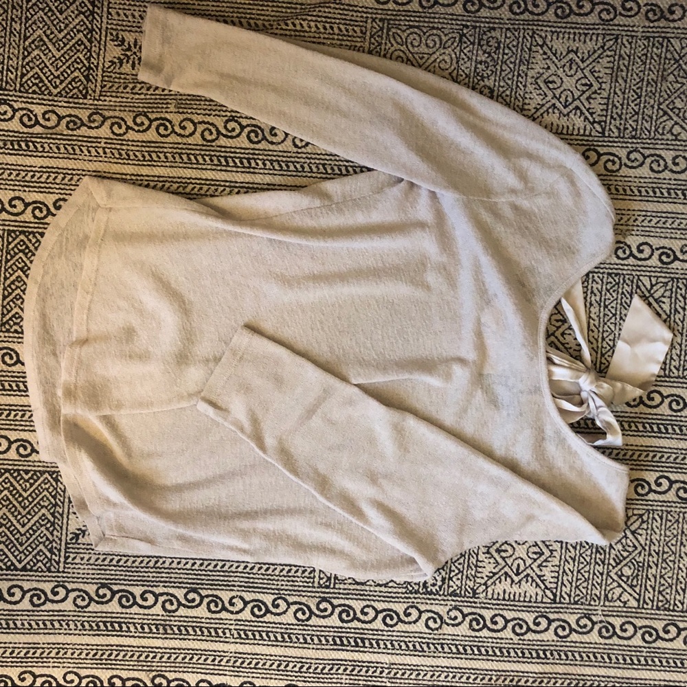 Tan sweater with bow in the back